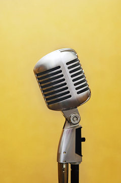 vocal studio microphone over yellow