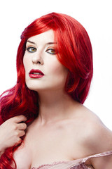 Fototapeta premium Woman hurt in his pride, long red hair looking at camera