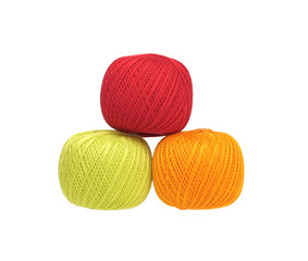 three balls of cotton  yarn isolated on white