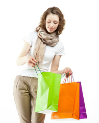 Young woman holding shopping paper bags