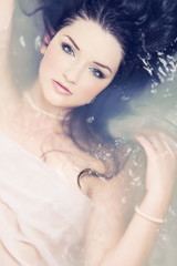 Beautiful woman in water