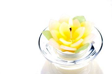 Lotus candle with a flame