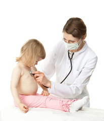 Female doctor examining little baby