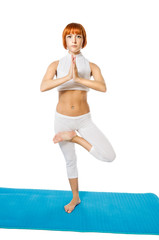 Fototapeta premium Young woman practicing yoga asana