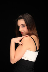 Fototapeta na wymiar beautiful young girl on a black background