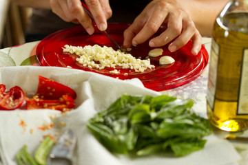 women cutting garlic