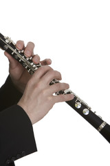 Clarinet player in front of white background