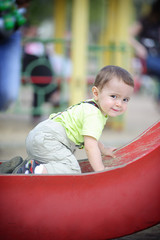 little boy on slide
