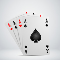 A winning poker hand of four aces playing cards