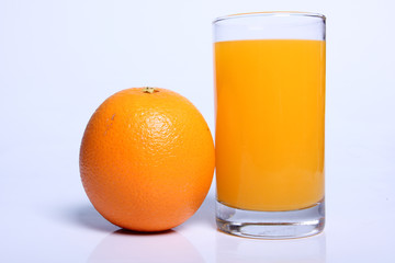one orang fruit with one juice