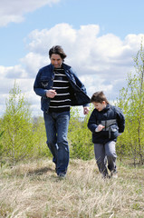 Dad and son relaxing outdoors