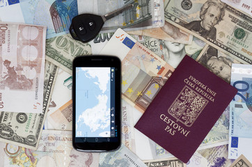 Czech passport car key and mobile phone on the banknotes
