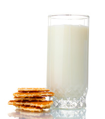 glass of milk and cookies isolated on white