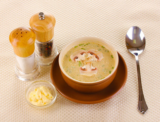 Tasty soup on beige tablecloth