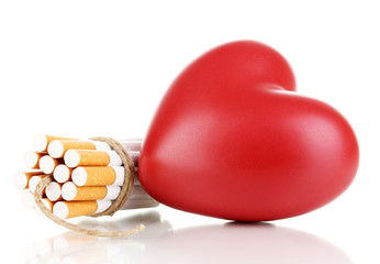 Cigarettes tied with rope and wick isolateed on white