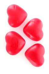 red candy hearts isolated on white