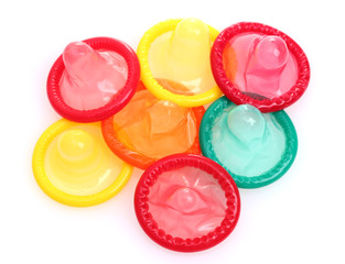 Colorful condoms isolated on white