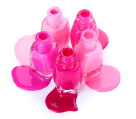 open bottles with bright nail polish isolated on white