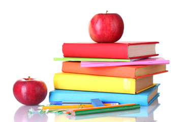 Composition of books, stationery and an apples isolated on white