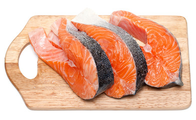 pieces of raw salmon on white background