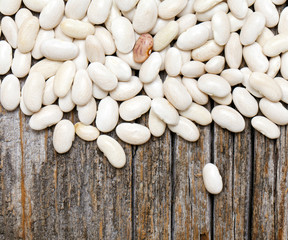 white beans on wooden surface