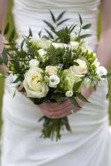 bride holding bouquet of flowers