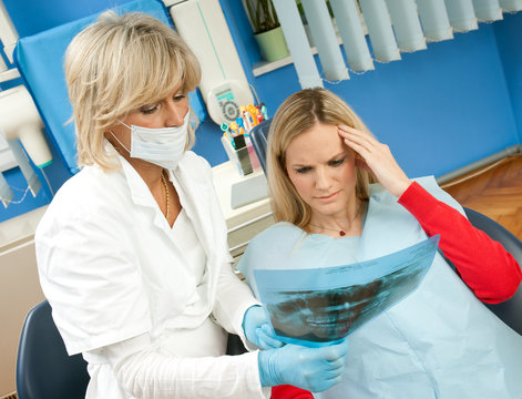 woman dentist with female patient