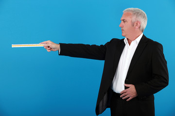 senior waiter against blue background