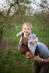 happy father with little son outdoor portrait