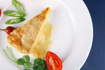 vegetable casserole piece over white plate