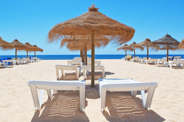 Beautiful beach with umbrellas in the sea. Portugal. Vila Moura.