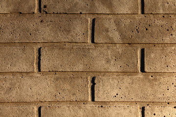 White concrete brickwall in afternoon sunlight