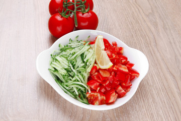 whole tomatoes on branch with salad