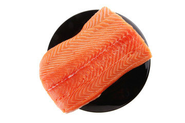 fresh raw salmon fillet on black