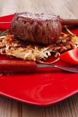 beef fillet pieces on noodles