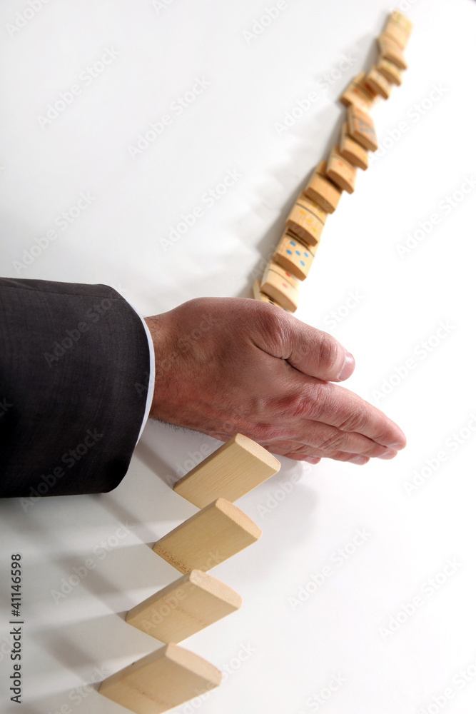 Poster Businessman with a line of dominoes