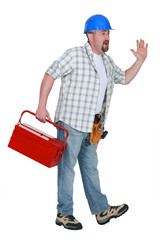 Worker with a toolbox waving