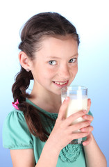 Portrait of beautiful little girl withglass of milk