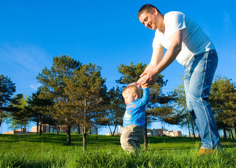 father and son in the meadow