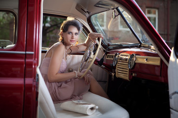 Woman in the vintage car