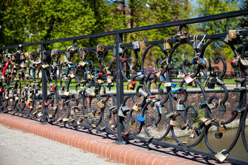 Many locks on the bridge railing, traditional marriage symbol.