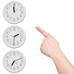 Three clock. Finger points to the clock
