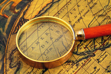 Old map and  magnifier