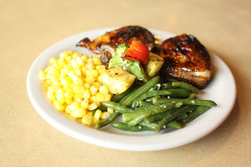 Delicious barbecue chicken with vegetables.
