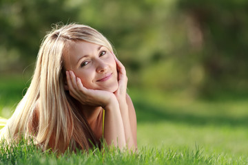 Naklejka na ściany i meble happy young attractive woman outdoors
