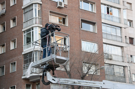 Cameraman working on an aerial work platform