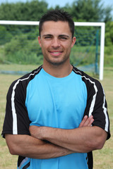 Fototapeta premium Football player stood on pitch