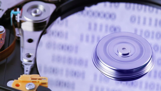 ard disk drive (hdd) working open with moving head, closeup