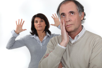 A middle age couple having a fight.