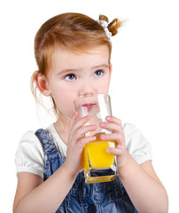 Portrait of beautiful little girl drinking a juice